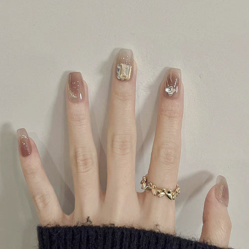 Artificial nail art with elegant jewelry accents Bowlift
