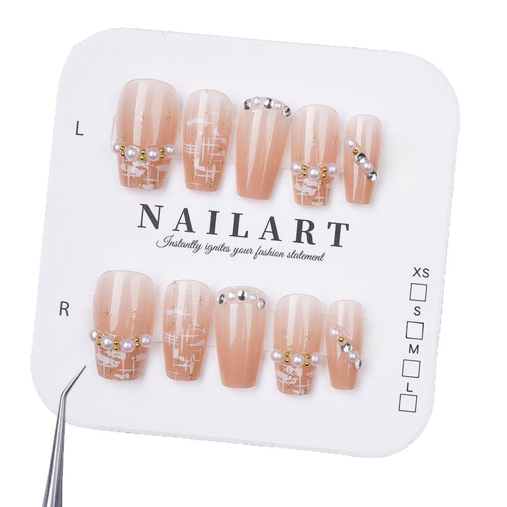 Artificial nails with elegant pearl and glitter decorations Bowlift