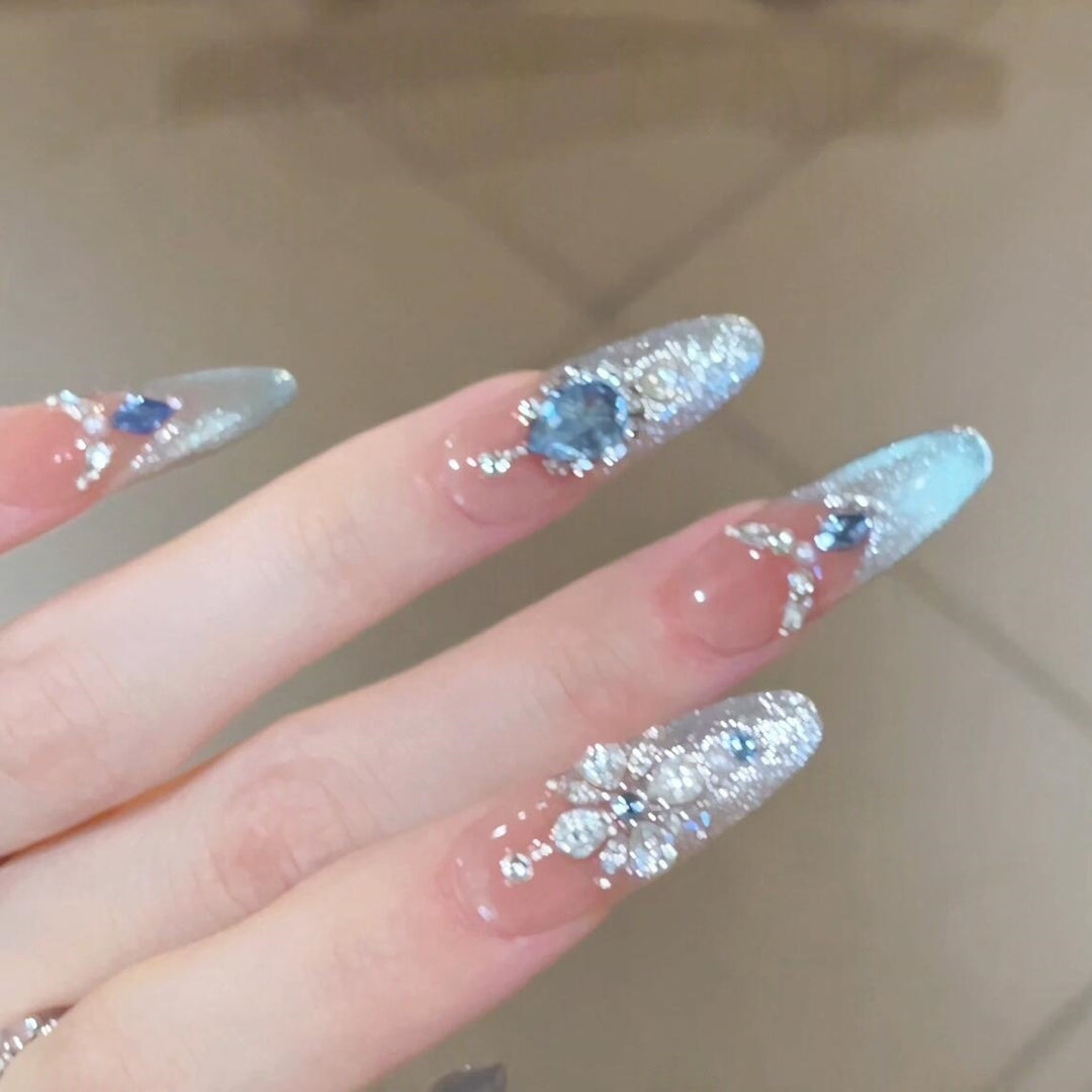 Glamorous artificial nails with sparkling rhinestone accents Bowlift
