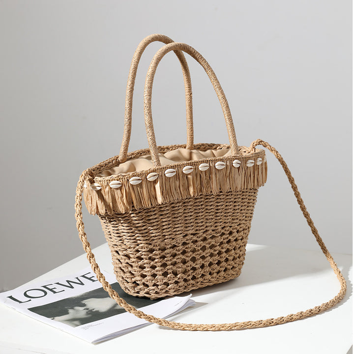 Braided straw bag with decorative tassel detail Bowlift