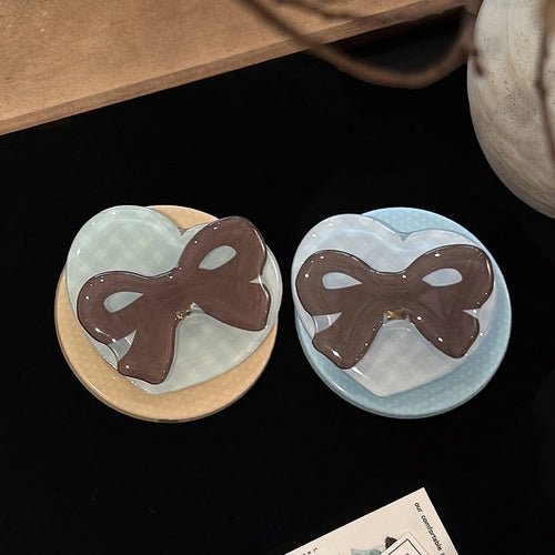 Decorative ceramic coaster with bow motif Bowlift