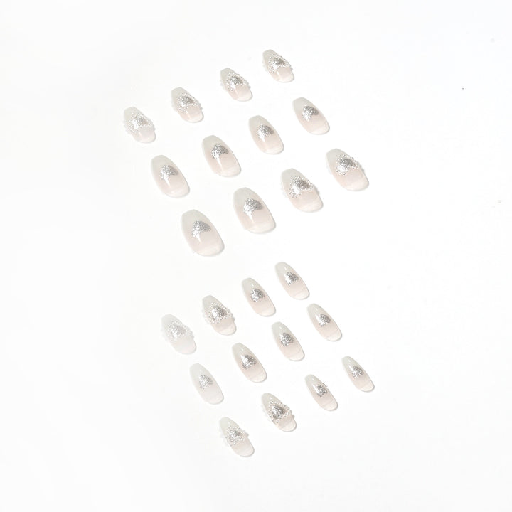 Artificial nail art with heart and rhinestone decorations Bowlift