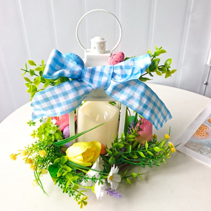Decorative table lantern with artificial flowers and ribbon Bowlift