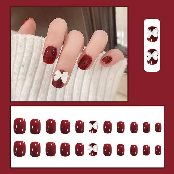 Artificial nails with elegant bow motifs Bowlift