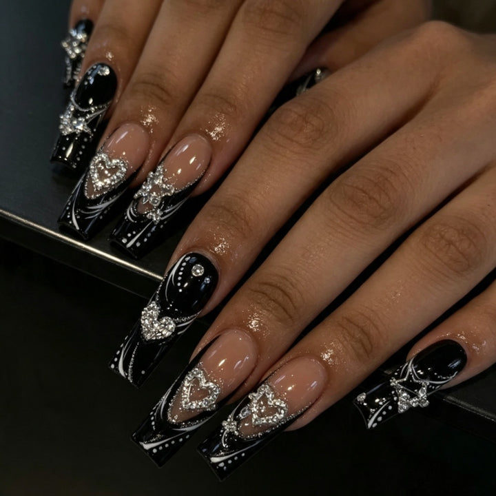 Artificial nails with elegant glitter accents and heart motifs Bowlift