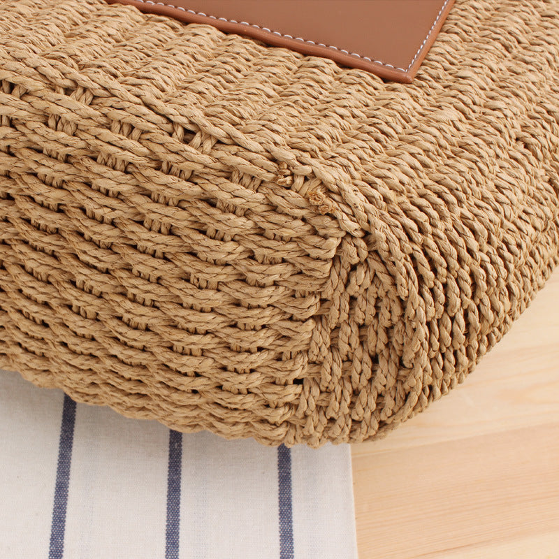 Tote bag made of braided natural material with elegant leather back Bowlift