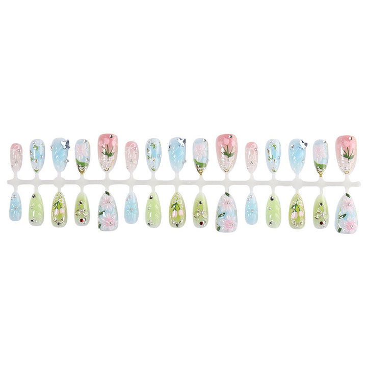 Acrylic nail set with handcrafted floral designs and glitter accents Bowlift