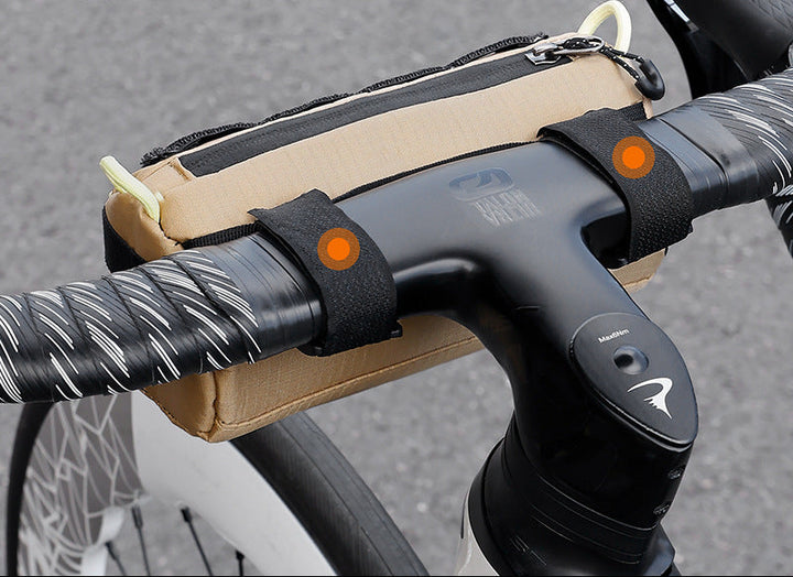 compact cylindrical handlebar bag with elastic bungee and universal Velcro mount Bowlift