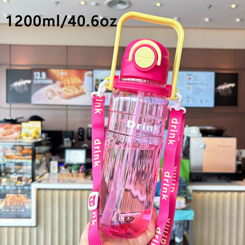 Women's large transparent drinking bottle with integrated carrying handle Bowlift