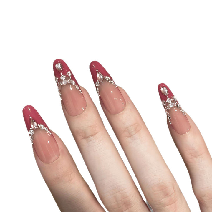 Artificial nails with sparkling rhinestone accents Bowlift