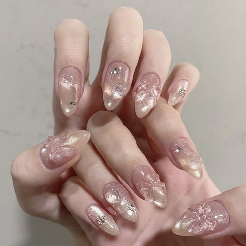 Artful stiletto nails with floral design and glitter accents Bowlift