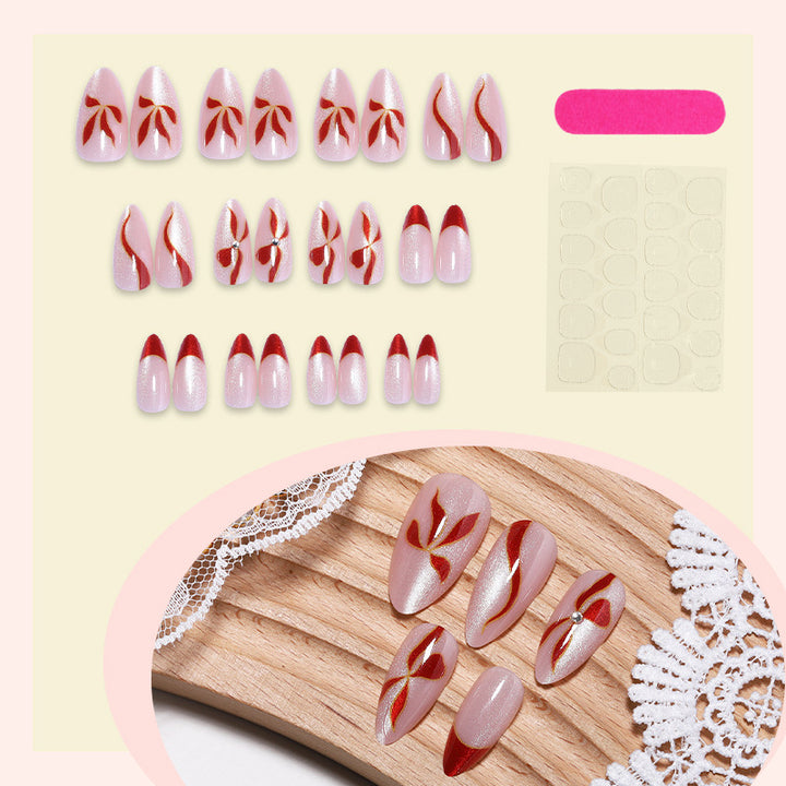 Acrylic nail set with elegant bow and glitter accents Bowlift