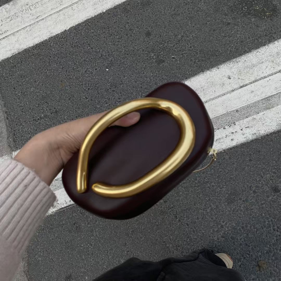 Statement Clutch with Sculptural Handle Bowlift