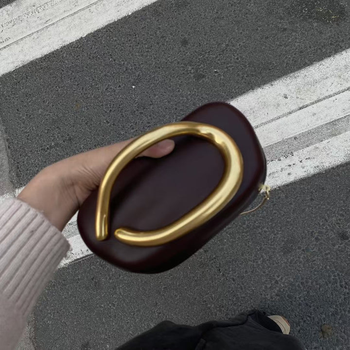 Statement Clutch with Sculptural Handle Bowlift