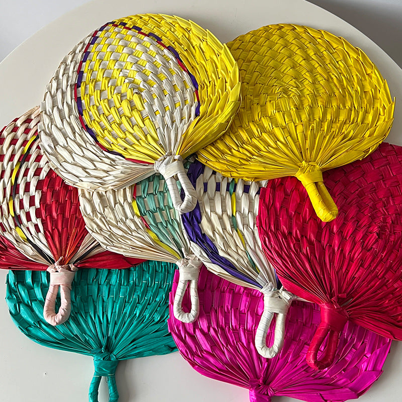 Women hand-woven fan made of natural material Bowlift