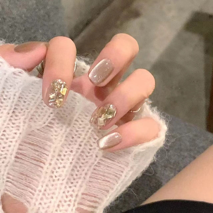 Acrylic nail set with glamorous gold details Bowlift