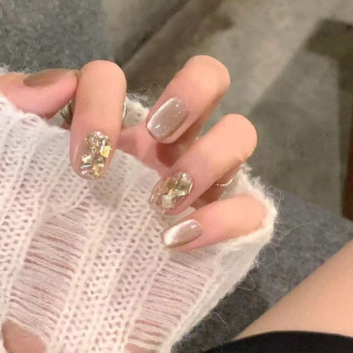 Acrylic nail set with glamorous gold details Bowlift