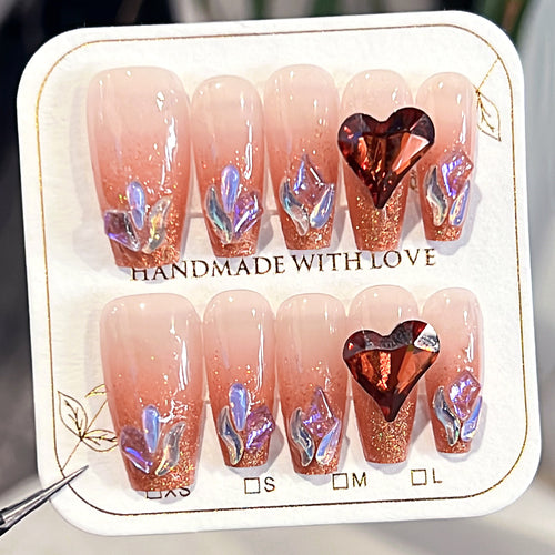 Artistic acrylic nails with heart design and sparkling accents Bowlift