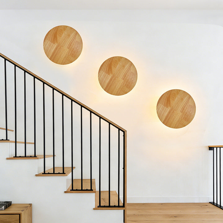 Organic pebble-shaped LED wall sconce solid wood face warm ambient backlight Bowlift