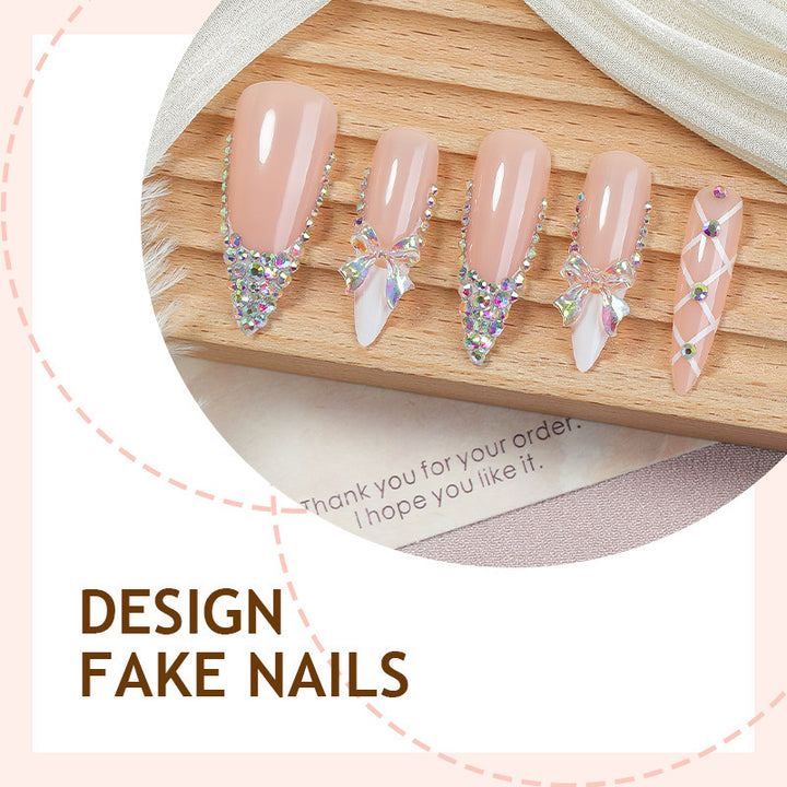 Acrylic nail set with luxurious rhinestone embellishments and bow accents Bowlift