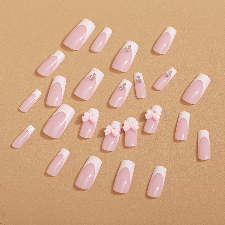 Trendy French-design artificial nails with bow accents Bowlift