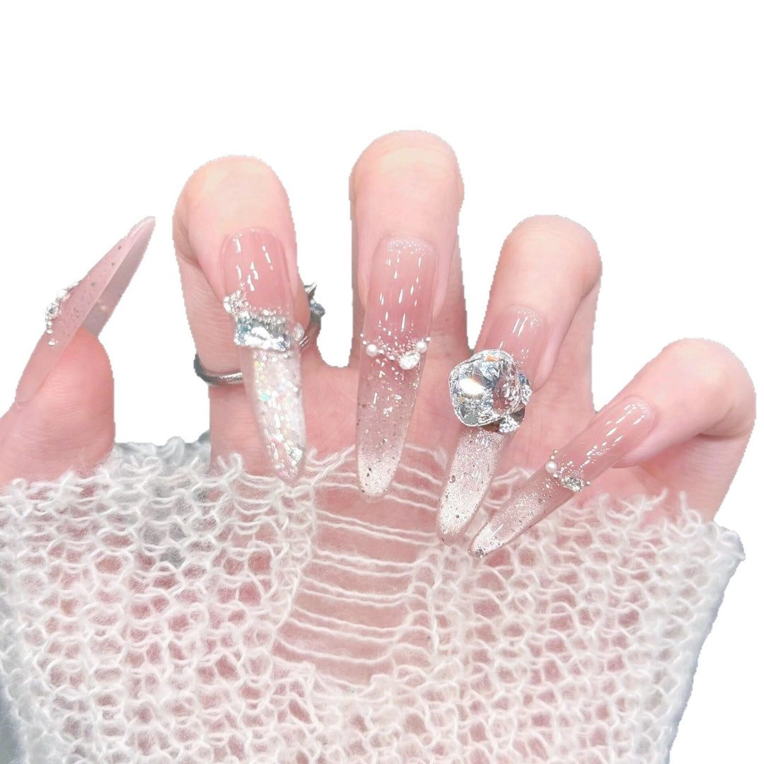 Artificial nails with glitter and crystal embellishments Bowlift