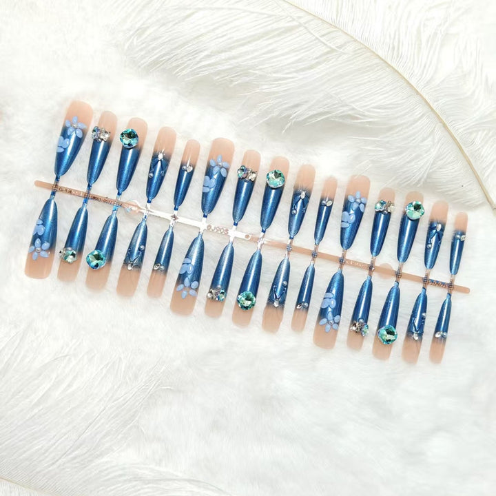 Elegant artificial nails with floral applications and glitter elements Bowlift