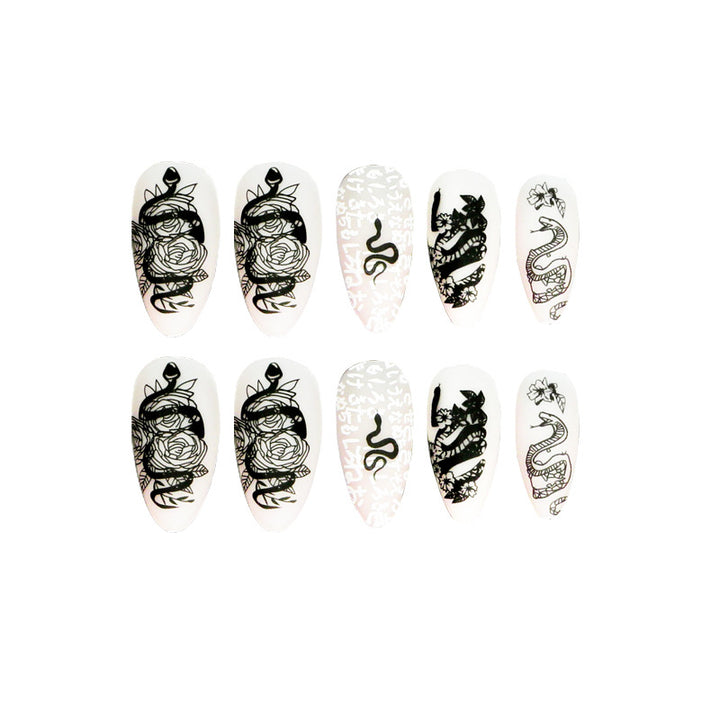 Artful nail extensions in elegant stiletto style with artistic floral and graphic designs Bowlift