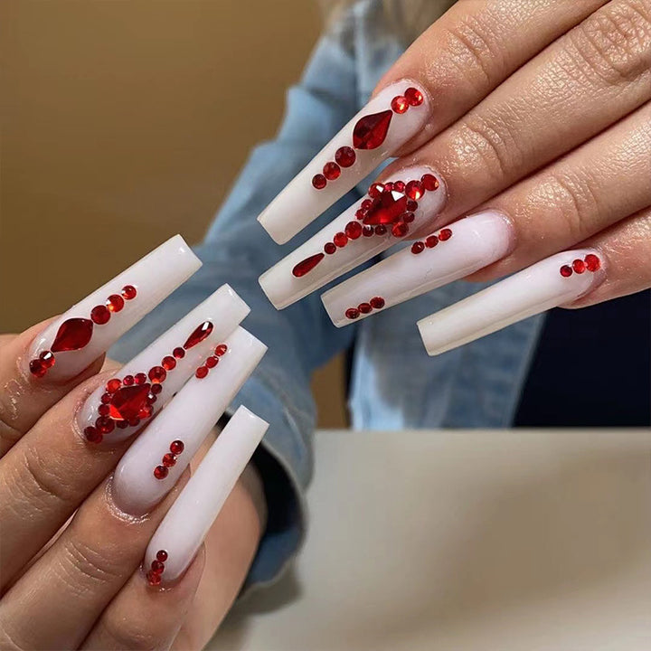 Artful nail extensions with glitter accents and elegant embellishments Bowlift