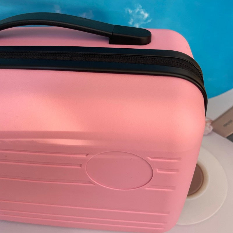 compact hardshell travel carry case with top handle and reinforced ridged shell Bowlift