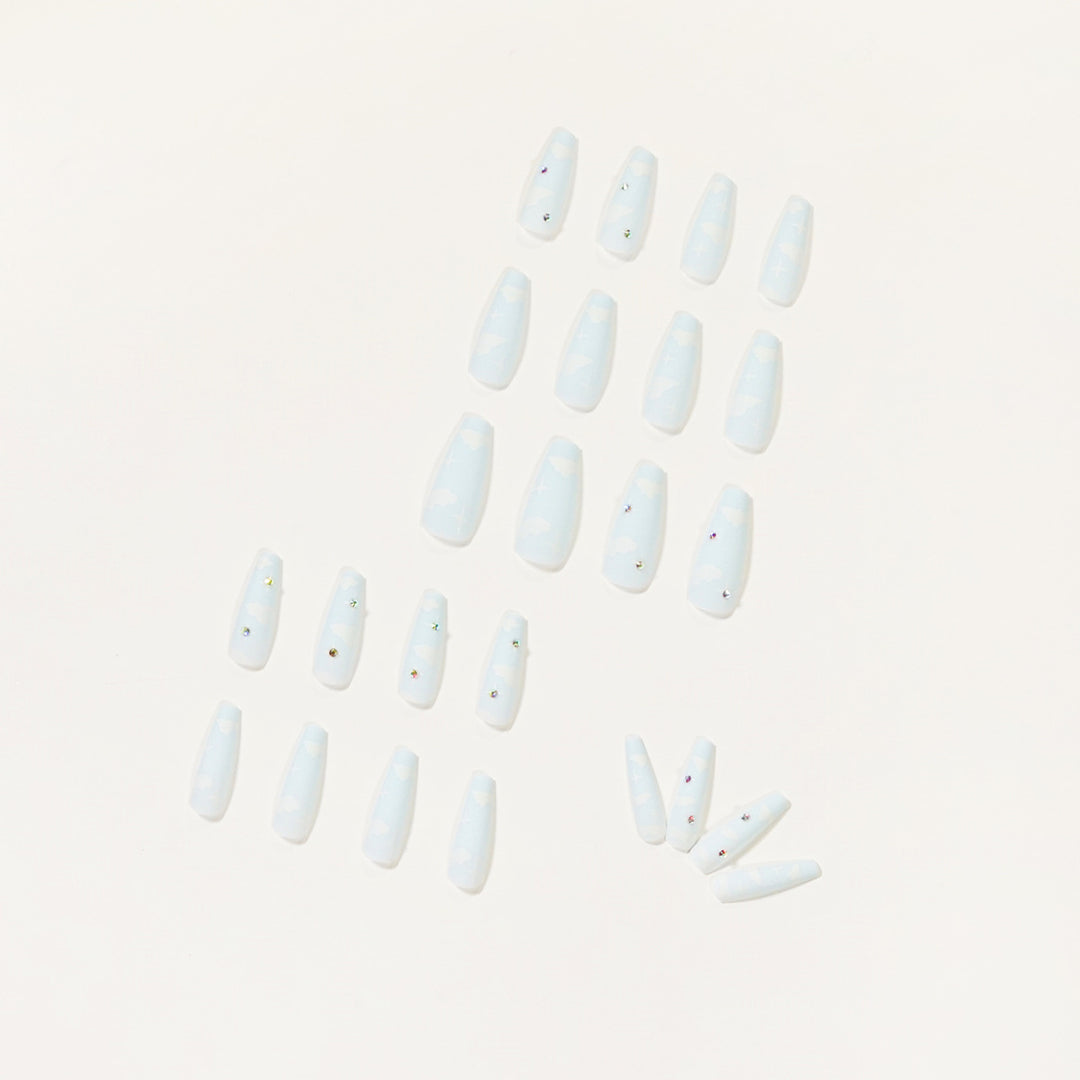 Creative nail art in cloud design with glitter accents Bowlift