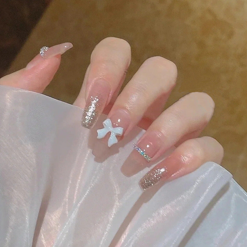 Glamorous artificial nails with heart accents Bowlift