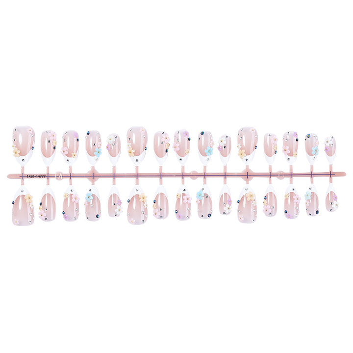 Artificial nail set with delicate floral decorations and sparkling rhinestones Bowlift