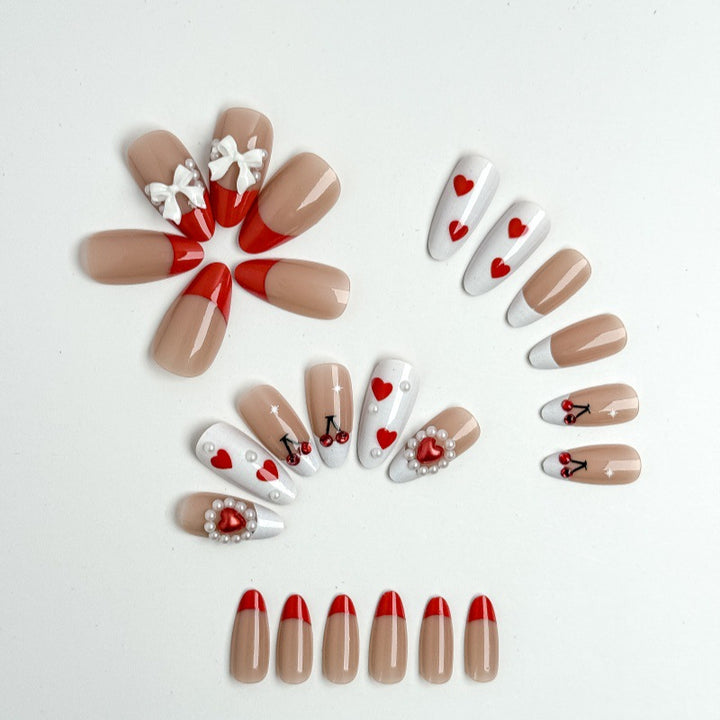 Creative nail art with heart and cherry motifs Bowlift