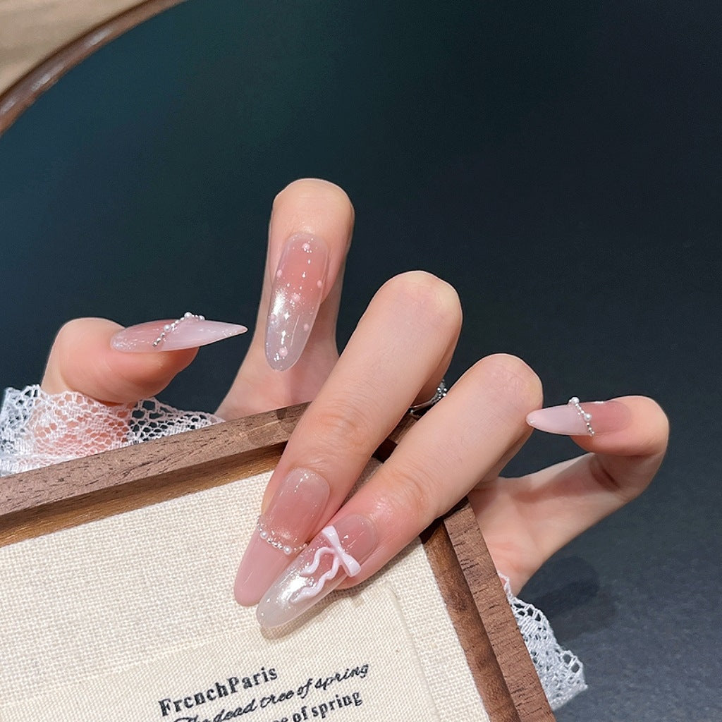 Elegant Long Press-On Nails with Decorative Accents Bowlift