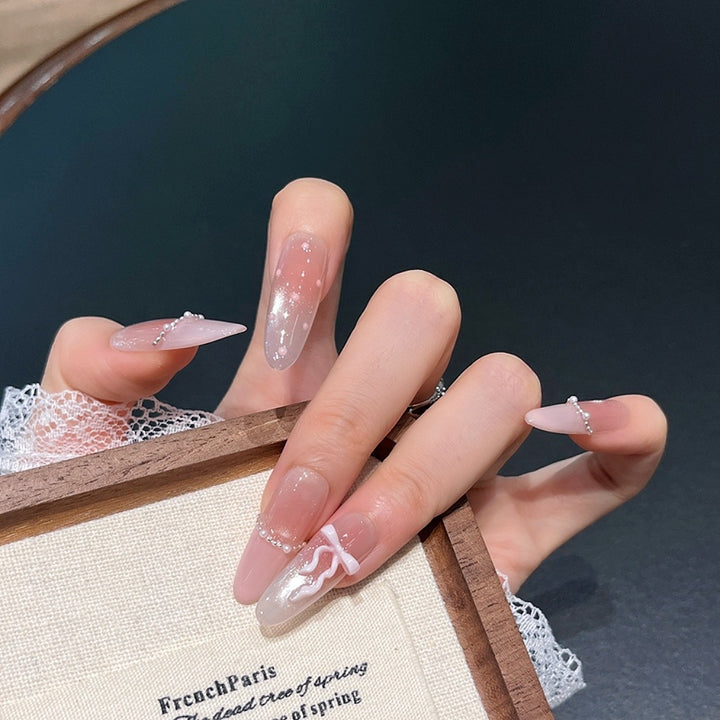 Elegant Long Press-On Nails with Decorative Accents Bowlift