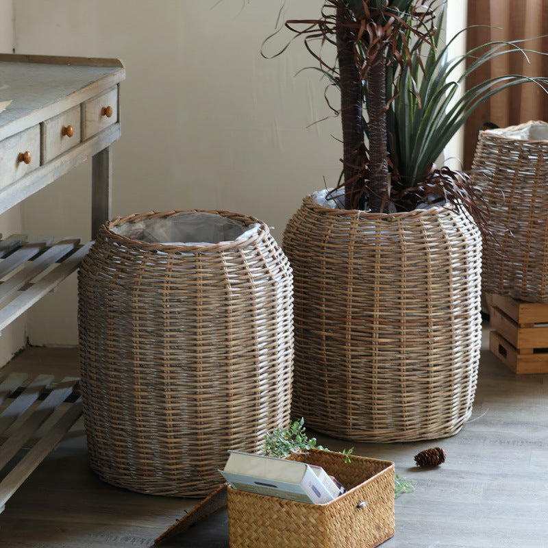 Stylish laundry basket made of braided natural material Bowlift
