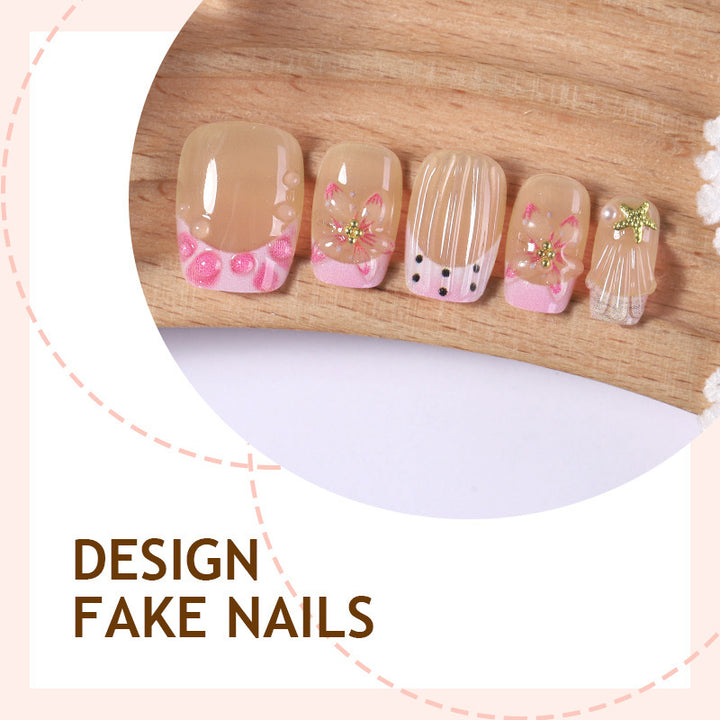 Artificial nail set with floral accents and glamorous decorations Bowlift
