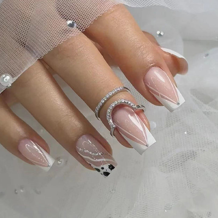 Artificial nails with elegant French design and glitter details Bowlift