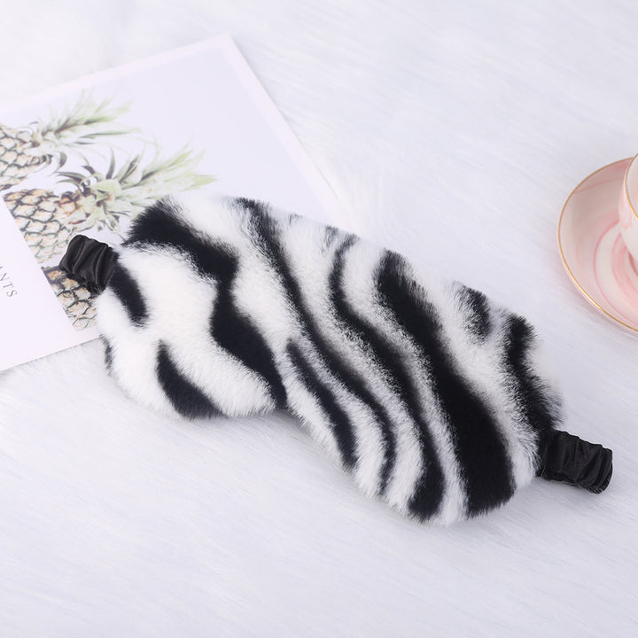 Women's cuddly faux fur sleep mask with heart-embossed surface and gathered comfort band Bowlift