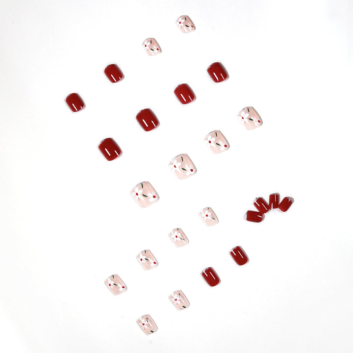Artful nail art with floral motifs and glitter accents Bowlift