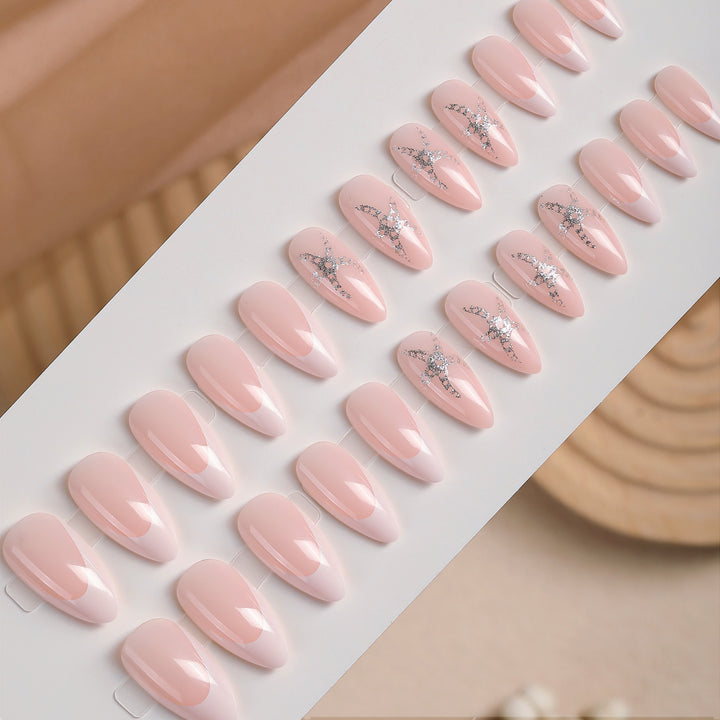 Artificial nail set with delicate pearlescent and glitter accents Bowlift