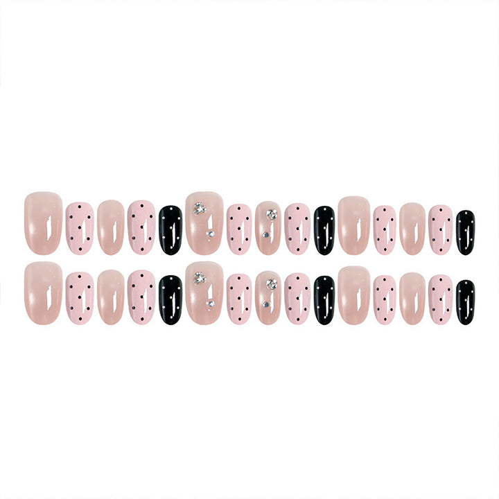Acrylic nail set with glamorous rhinestone accents and modern dots Bowlift