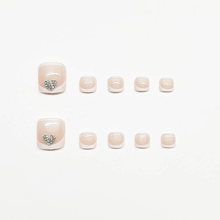 Artifical nail set with glamorous heart design and elegant French tip Bowlift