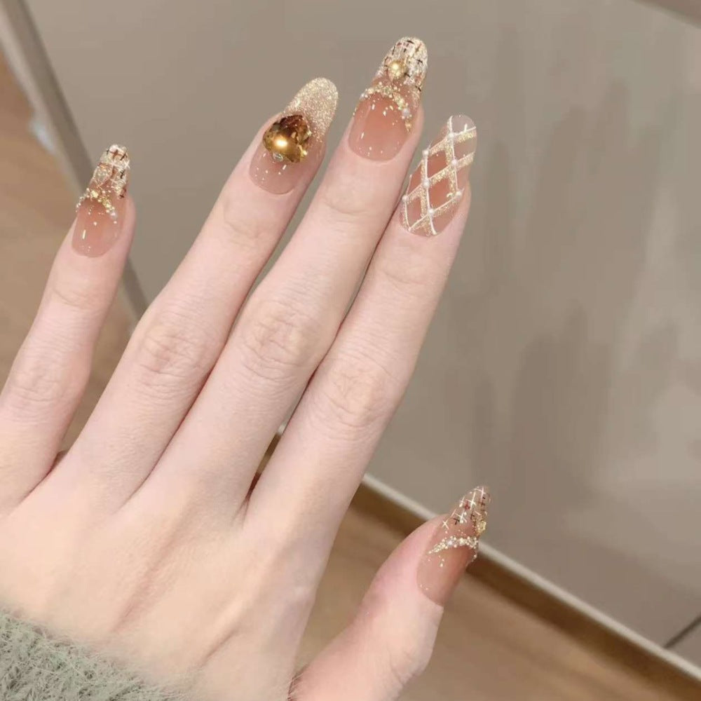 Artificial nails with glamorous rhinestone decorations Bowlift