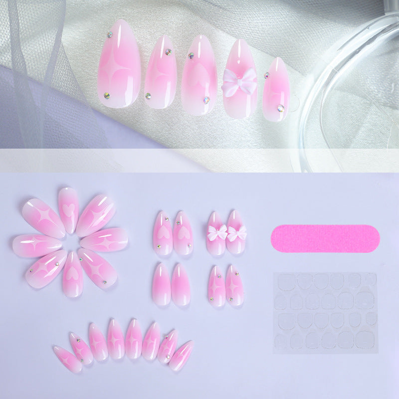 Acrylic nail set with delicate heart-shaped accents Bowlift