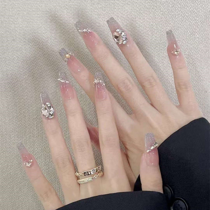 Elegant artificial nails with sparkling gold accents Bowlift