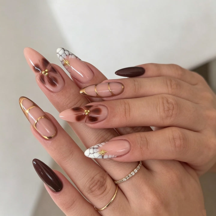 Artificial nails with elegant marble pattern and delicate accents Bowlift