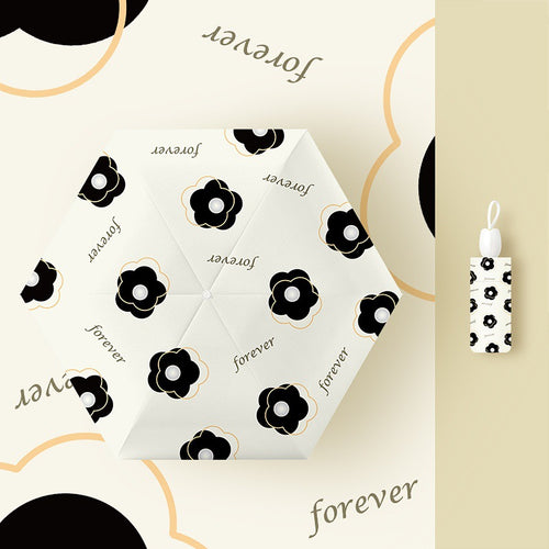 Ladies folding umbrella with playful flower design Bowlift