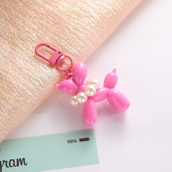 Playful keychain with balloon dog and beads Bowlift